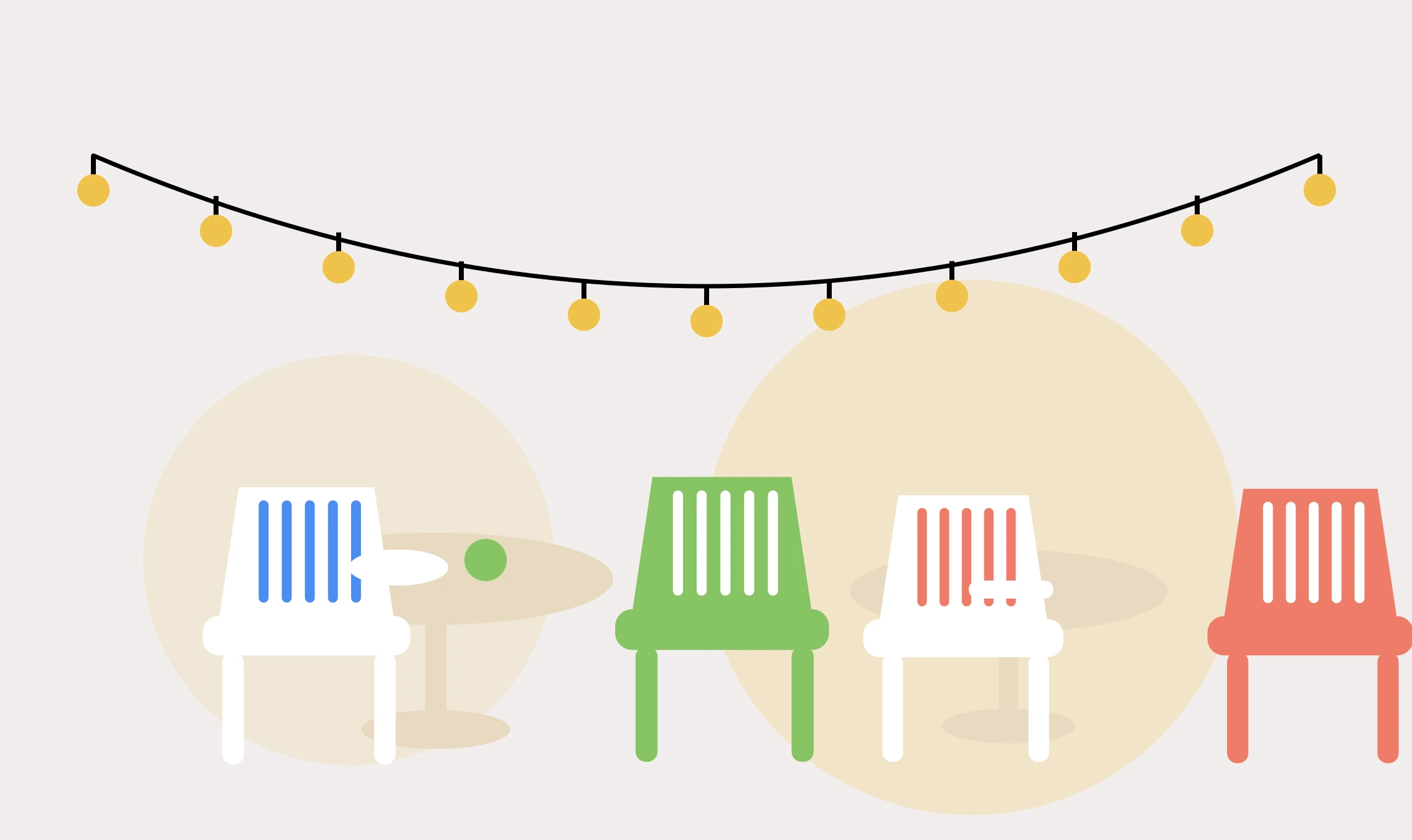 A string of festoon lights above four chairs, one of them drawn up to a small round table.